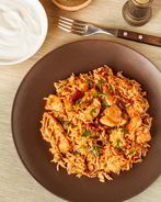 Пряный пилав с курицей и вялеными томатами